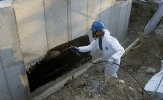 Professional waterproofing the exterior walls of the basement in Anaheim, CA