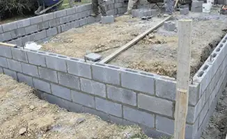Professionals building a foundation with blocks in Anaheim, CA